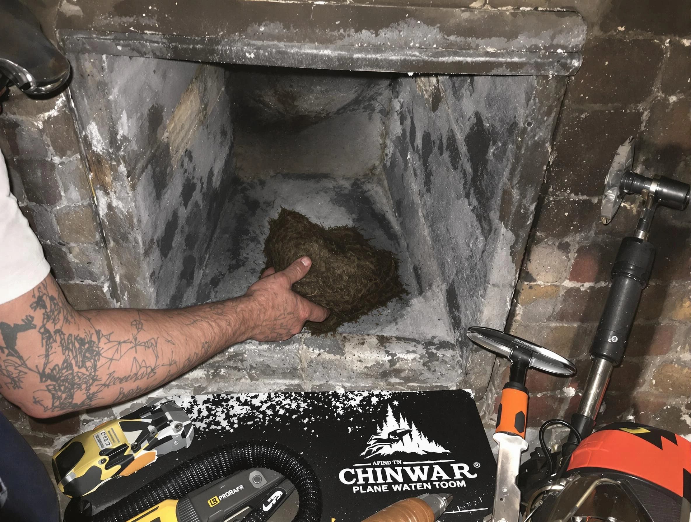 O'Hara Chimney Sweep safely removing debris and screening chimney in O'Hara, PA