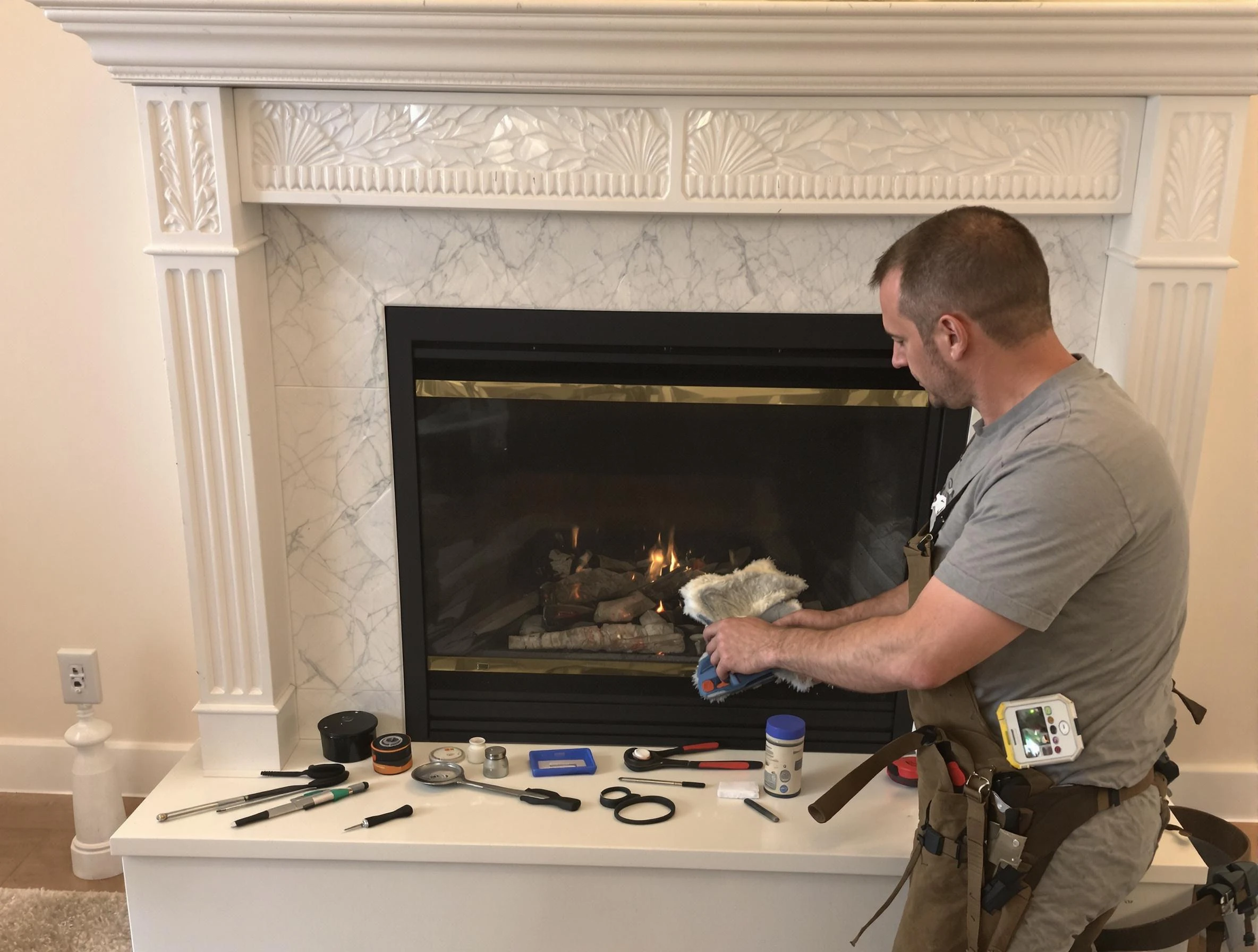 O'Hara Chimney Sweep performing fireplace maintenance in O'Hara, PA